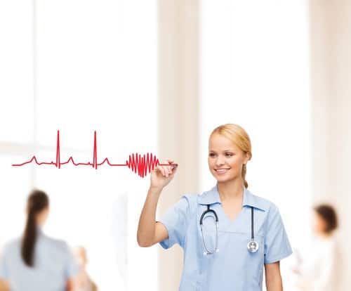 healthcare, medical and technology - young doctor or nurse drawing electrocardiogram